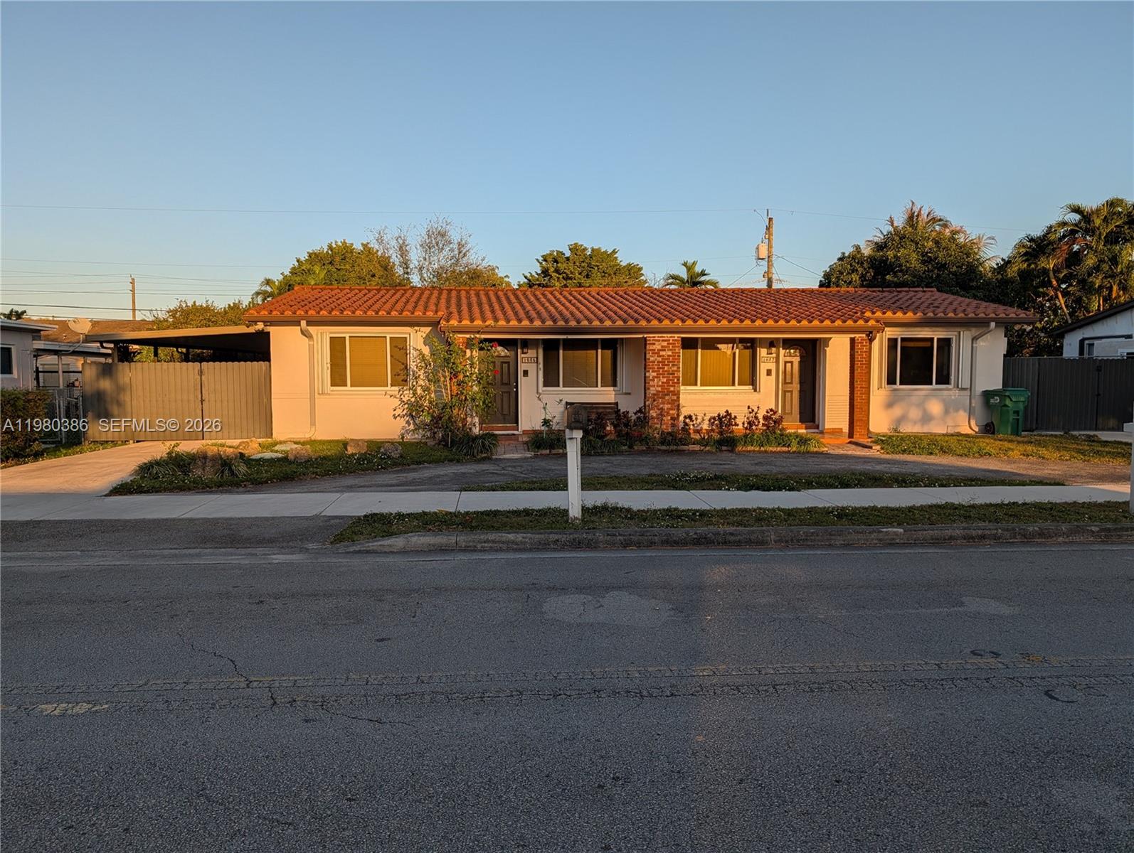 A single-story duplex with a terracotta tile roof and a paved driveway — 1037 SW 76th Ave # 1037, Miami FL 33144, MIAMI, FL