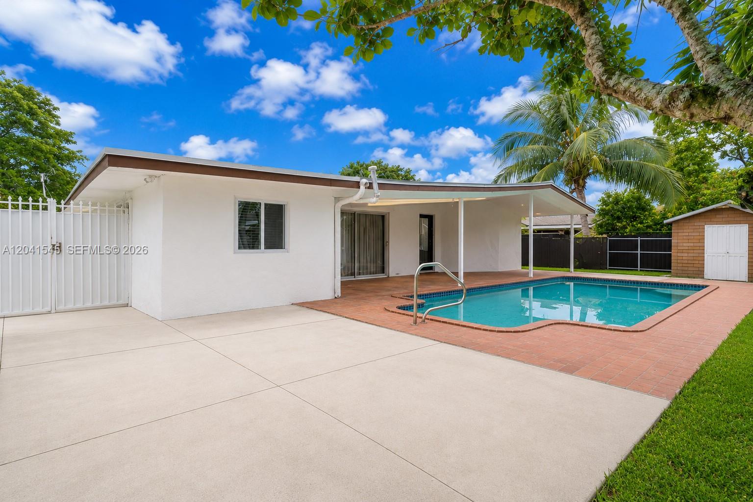 A white house with a covered patio and swimming pool in a backyard — 18670 Belview Dr, Cutler Bay FL 33157, CUTLER BAY, FL