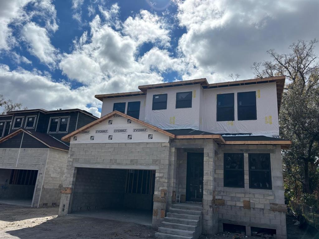 A two-story house under construction with concrete block walls and a garage — 2120 W BIRD ST., TAMPA, FL