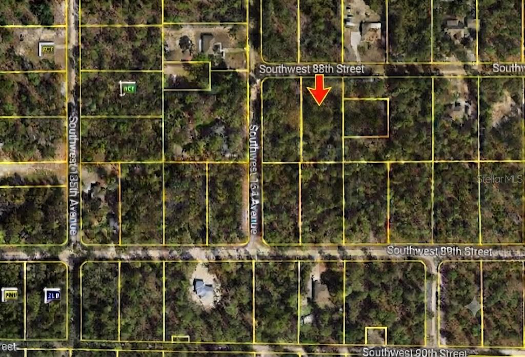 This is an aerial map view of a vacant, wooded residential lot outlined in yellow — SW 88 STREET, DUNNELLON, FL