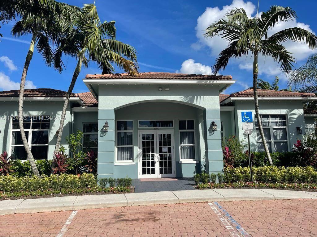 A single-story building with a tiled roof, palm trees, and a handicap parking sign — 3550 Oleander Ter, Riviera Beach FL 33404, RIVIERA BEACH, FL