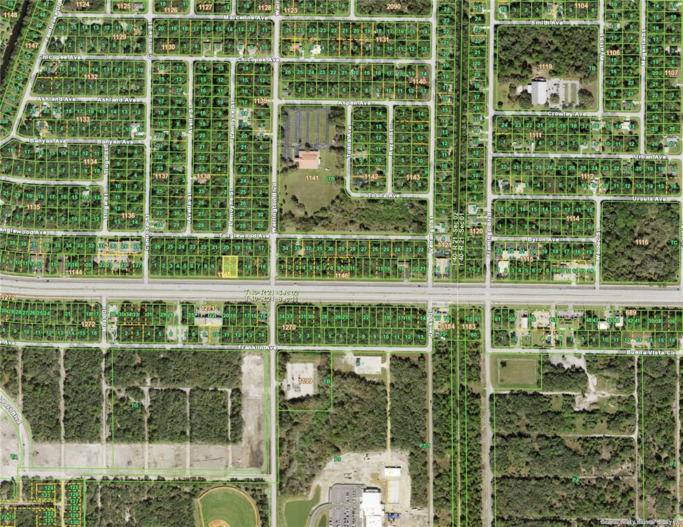 This is an aerial map showing a residential neighborhood with platted lots and street layouts — 670 & 672 TAMIAMI TRAIL, PORT CHARLOTTE, FL