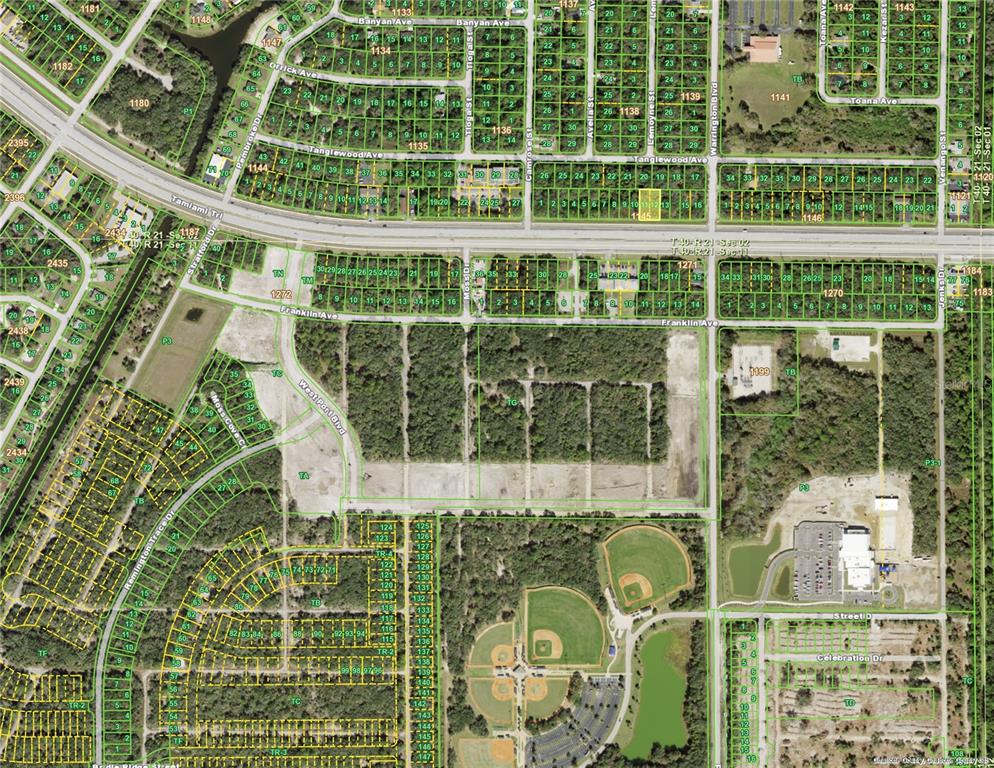 This is an aerial map showing residential lots, streets, and undeveloped land — 670 & 672 TAMIAMI TRAIL, PORT CHARLOTTE, FL