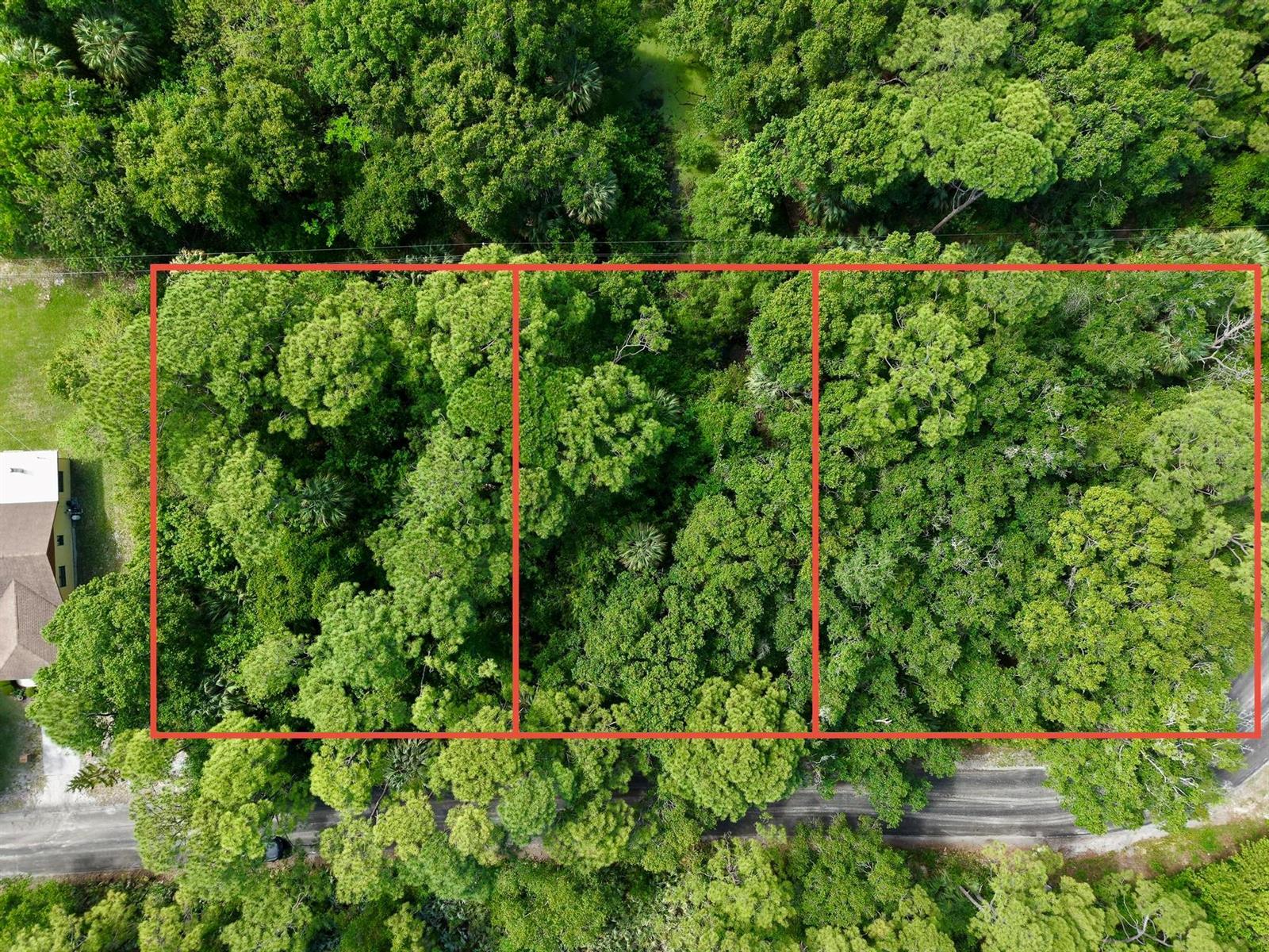An aerial view shows three adjacent, heavily wooded rectangular lots bordered by a paved road — 0000 Notlem Drive, Fort Pierce FL 34982, FORT PIERCE, FL