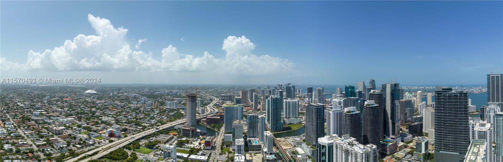 A high-angle panoramic view of the Miami skyline featuring numerous skyscrapers and urban infrastructure — 1133 SW 2nd Ave. # 6402, Miami FL 33130, MIAMI, FL