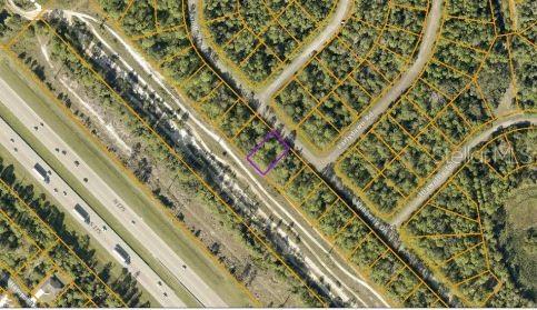 An aerial map view shows a highlighted vacant lot situated near a highway and residential streets — KIMBERLY DRIVE, NORTH PORT, FL