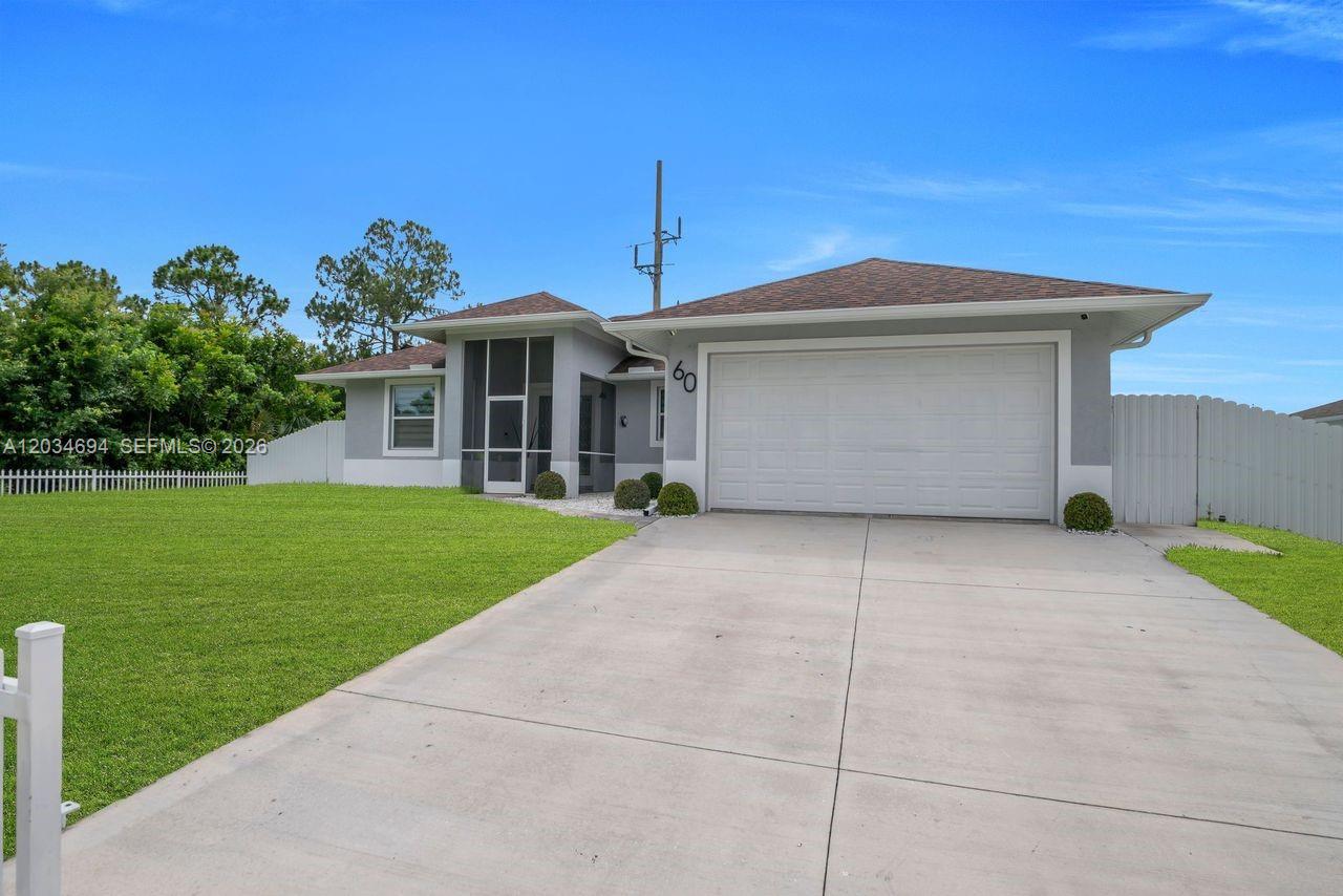A single-story house with a white garage door, gray exterior, and a screened front entryway — 60 Floyd Ave S, Lehigh Acres FL 33976, LEHIGH ACRES, FL