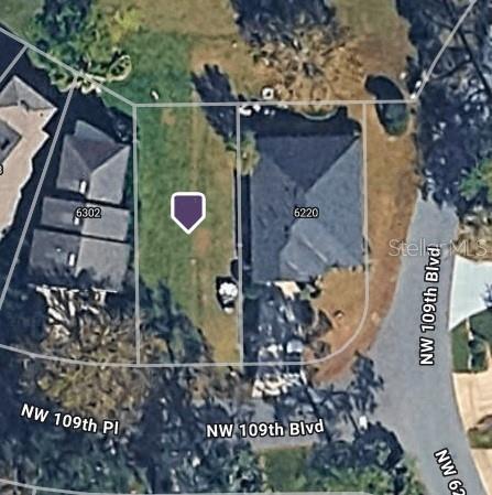 This is an aerial map view showing a vacant residential lot next to a house — NW 109TH PLACE, ALACHUA, FL