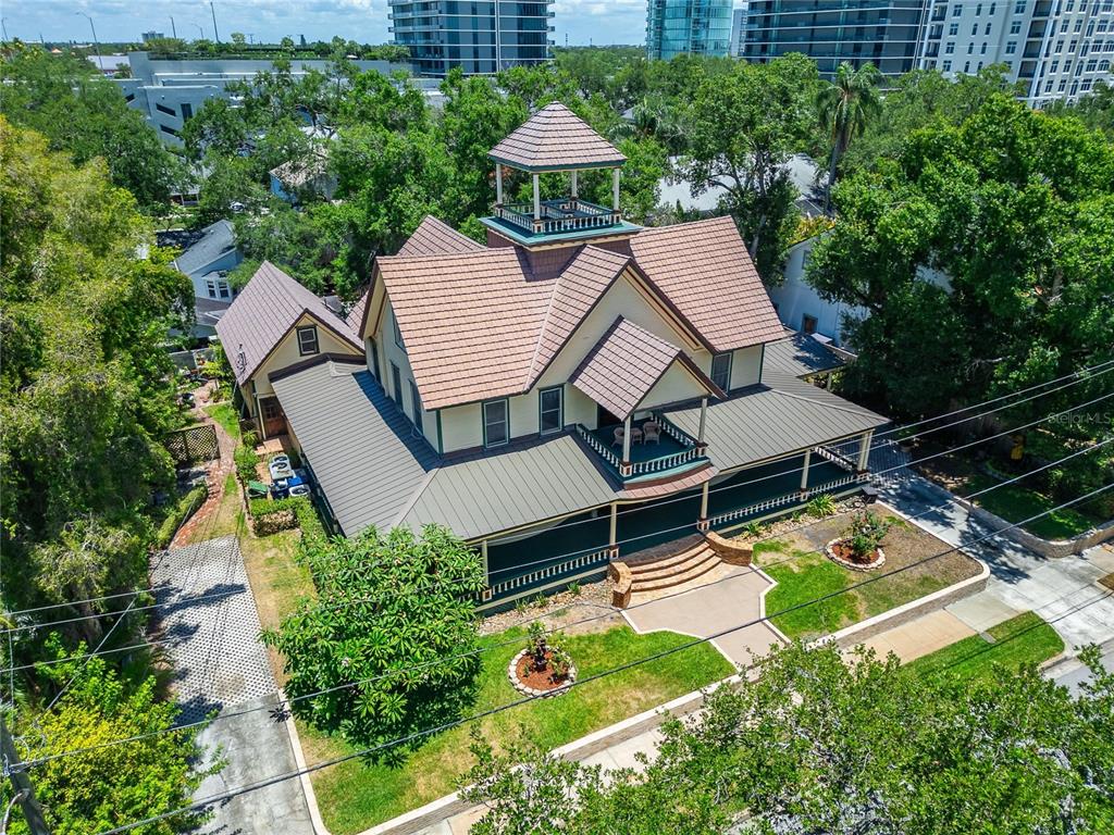 An aerial view of a two-story house with a cupola and a wraparound porch — 3007 W STOVALL STREET, TAMPA, FL