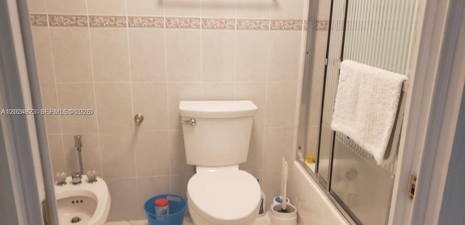 A bathroom features a toilet, a bidet, and a shower with a glass door — 3725 S Ocean Dr # 1208, Hollywood FL 33019, HOLLYWOOD, FL