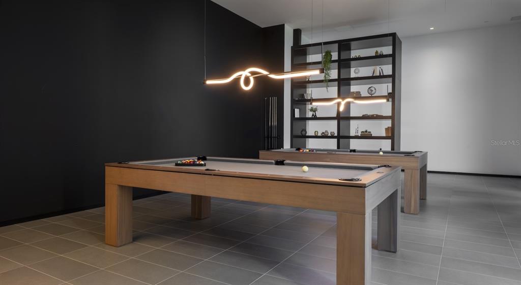 A game room features two pool tables with grey felt and modern light fixtures — 434 N ORANGE AVENUE, ORLANDO, FL
