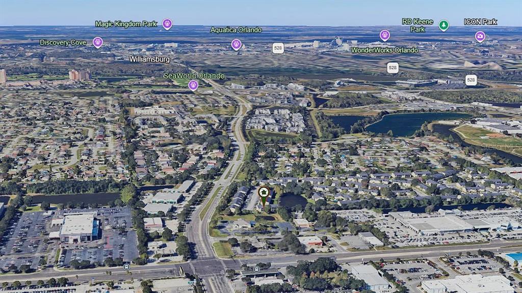 This is an aerial map view showing a residential property location relative to Orlando attractions — 2401 BARLEY CLUB DRIVE UNIT GE, ORLANDO, FL