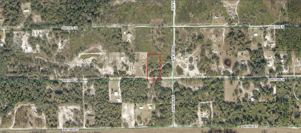 An aerial map shows a rectangular plot of land outlined in red near a road intersection — 4090-431-000 SW 158 LANE, DUNNELLON, FL