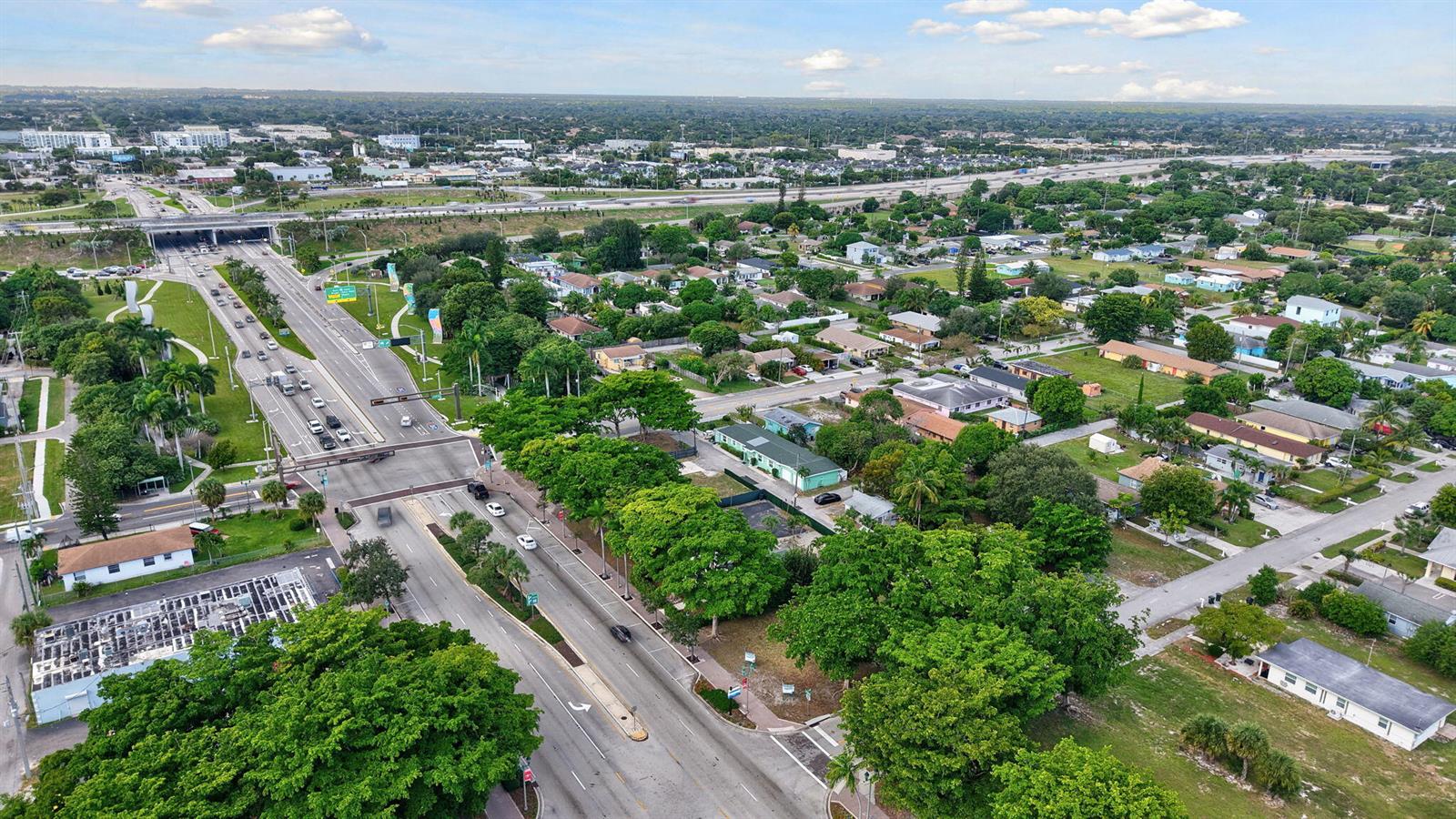 An aerial view shows a suburban neighborhood with a multi-lane road and highway overpass — 0 W Atlantic Avenue, Delray Beach FL 33444, DELRAY BEACH, FL