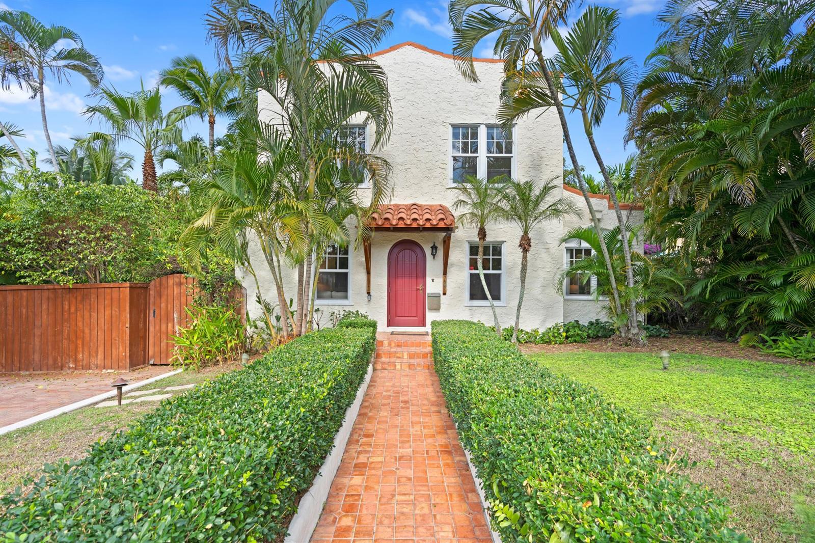 A two-story stucco house with a red arched door and a brick walkway — 727 Claremore Drive, West Palm Beach FL 33401, WEST PALM BEACH, FL