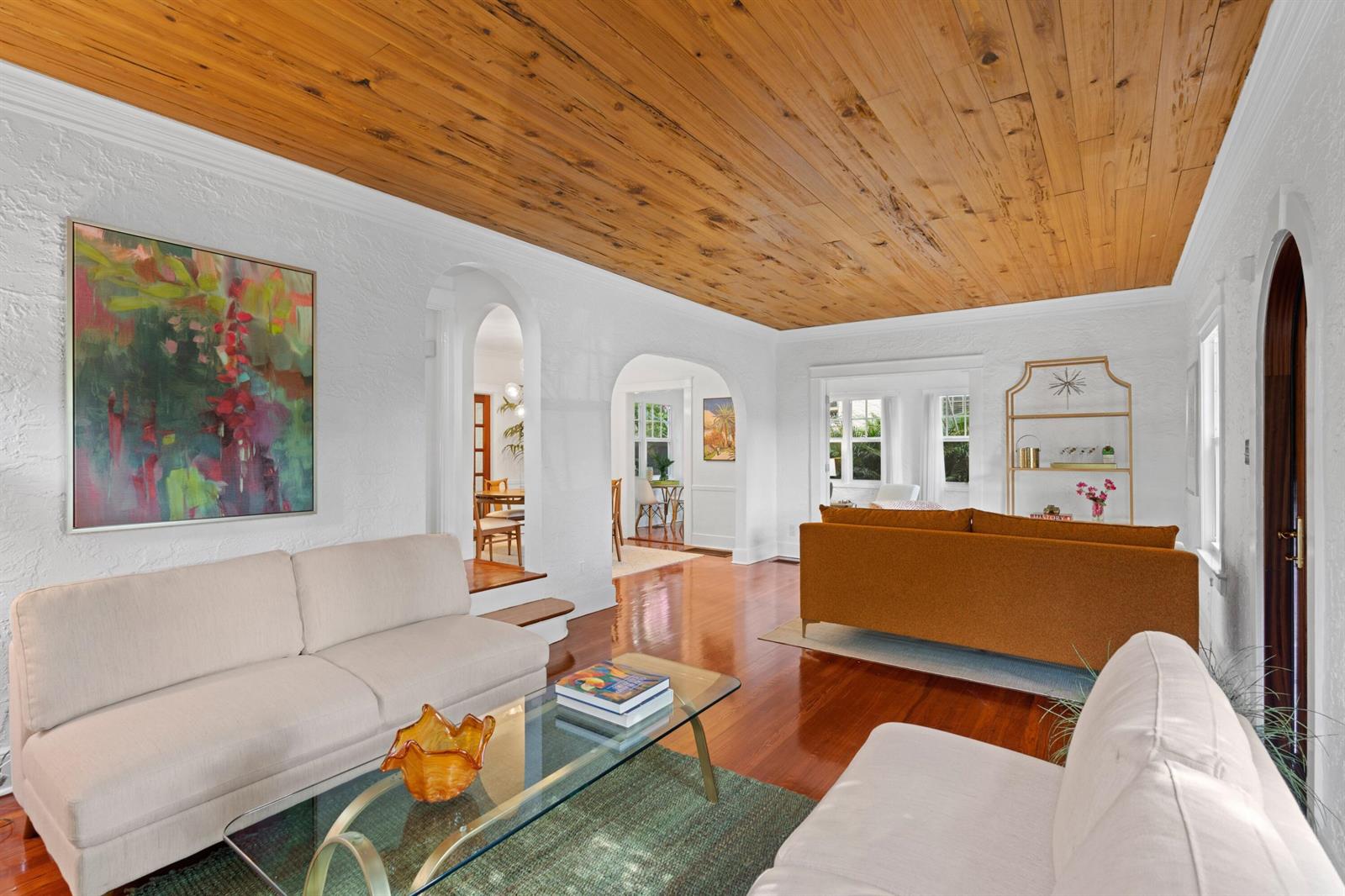A living room with white textured walls, a wood-plank ceiling, and hardwood floors — 727 Claremore Drive, West Palm Beach FL 33401, WEST PALM BEACH, FL
