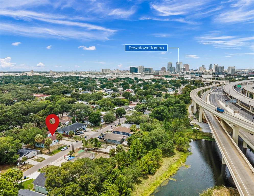 An aerial view shows a residential neighborhood near a highway overpass and downtown Tampa — 2813 DURHAM, TAMPA, FL