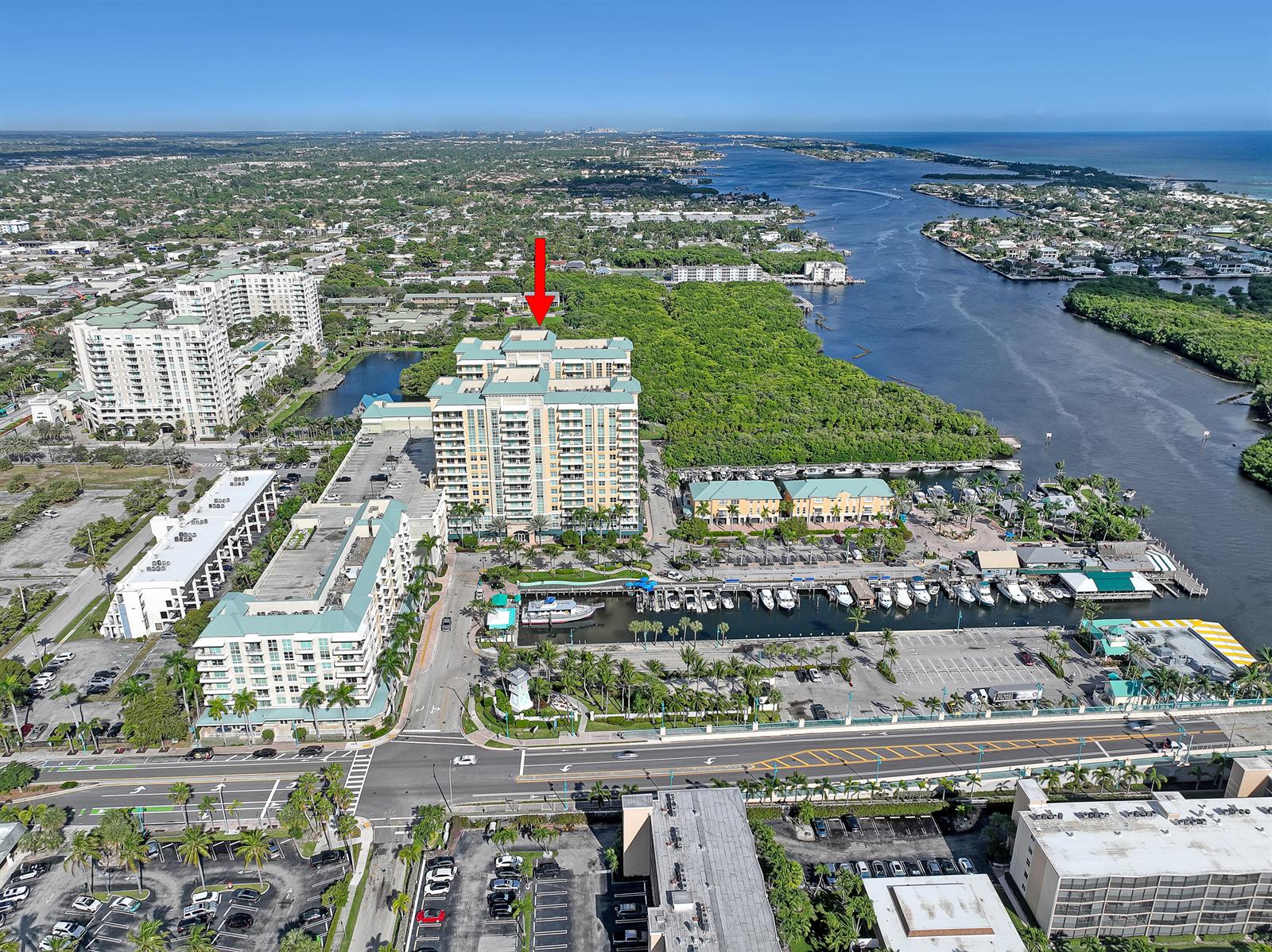 An aerial view shows a high-rise building with a red arrow pointing toward it — 700 E Boynton Beach Boulevard # 312, Boynton Beach FL 33435, BOYNTON BEACH, FL
