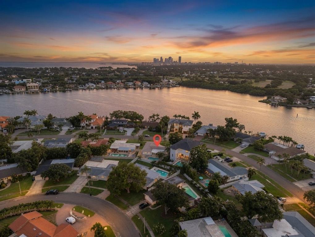 An aerial view shows a residential neighborhood with a waterfront house marked by a pin — 1022 EDEN ISLE DRIVE NE, ST PETERSBURG, FL