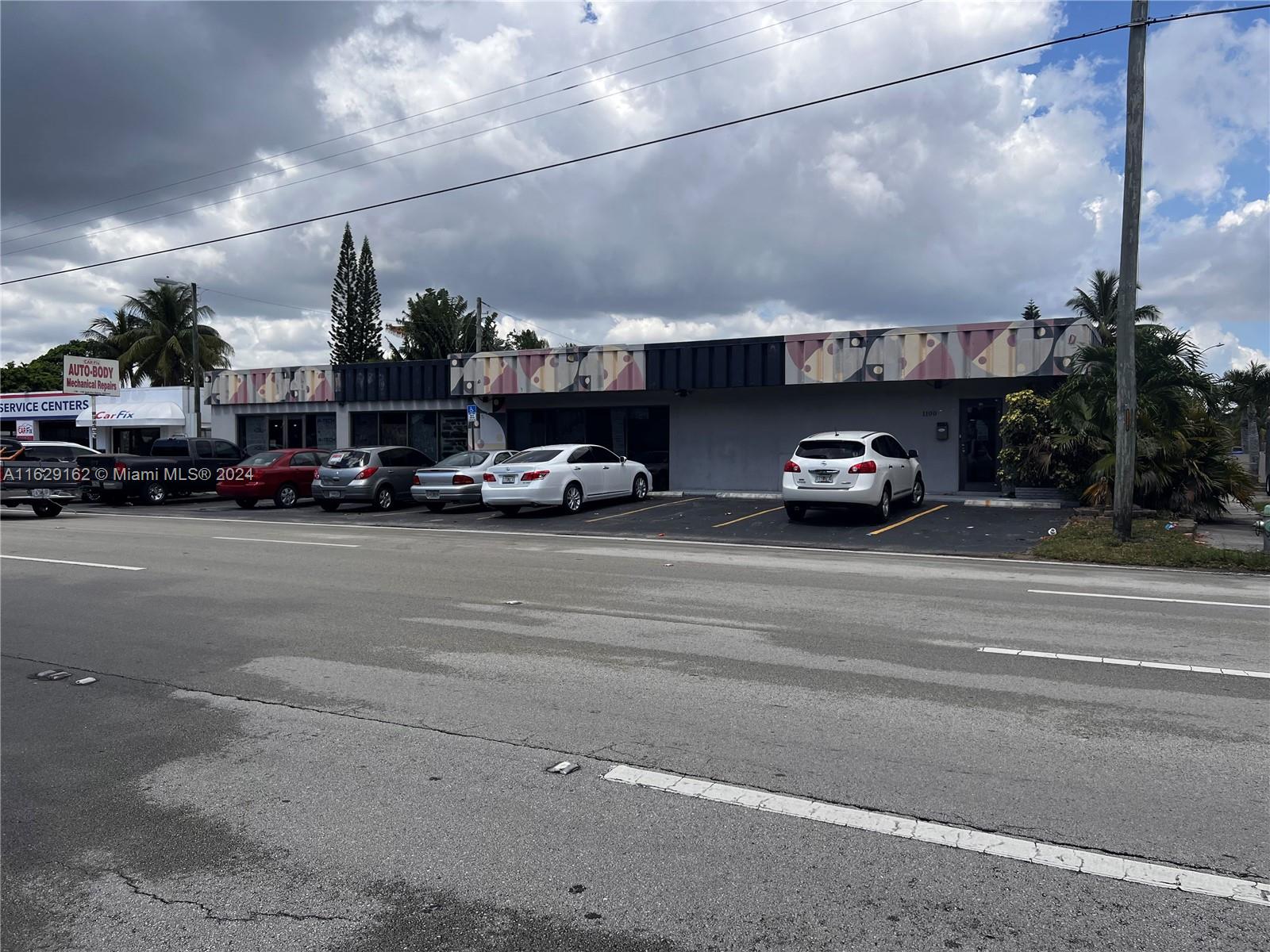 A commercial building with a patterned facade and parking lot sits along a paved road — 1100 S Dixie Hwy, Hollywood FL 33020, HOLLYWOOD, FL