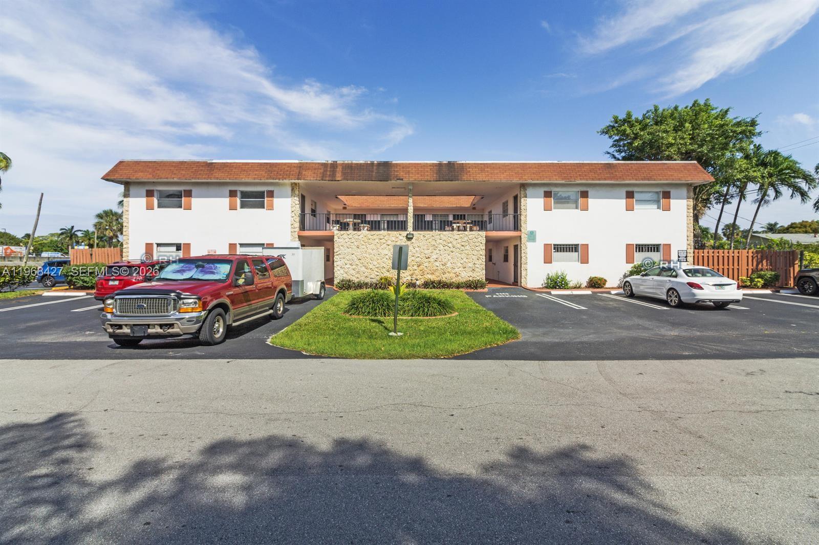 A two-story apartment building with a central courtyard and parking lot in front — 344 SW 1st St # 6, Pompano Beach FL 33060, POMPANO BEACH, FL