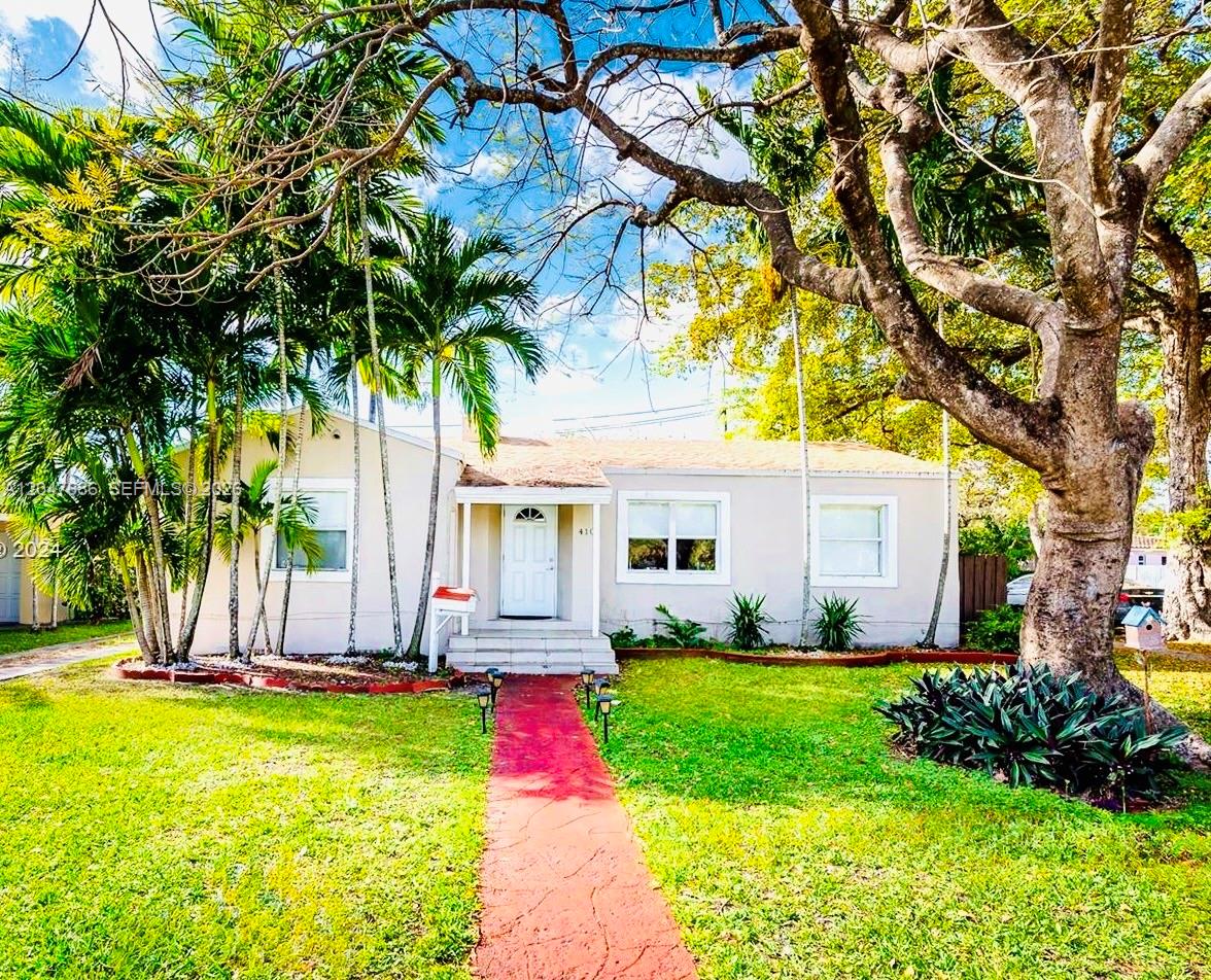 A single-story house with a red walkway, palm trees, and a large tree in the yard — 410 Pinecrest Dr # 1, Miami Springs FL 33166, MIAMI SPRINGS, FL