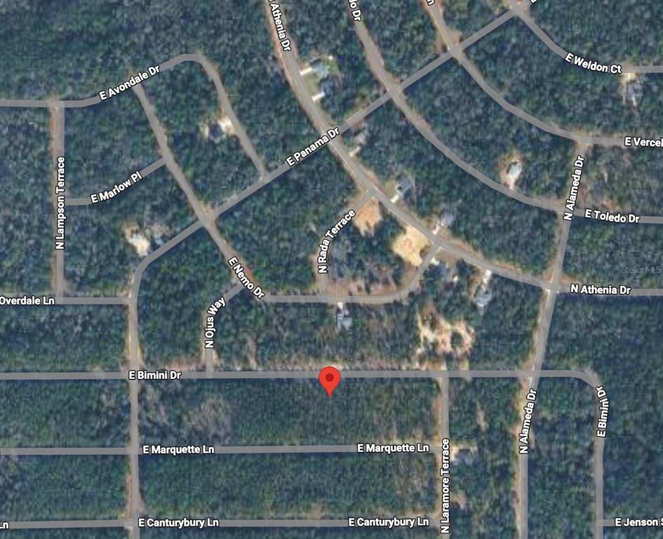 This is a satellite map view showing a residential area with a red location pin — 608 E BIMINI DRIVE, DUNNELLON, FL