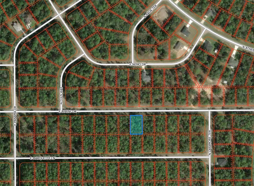 This is an aerial map showing a highlighted vacant lot in a wooded residential area — 608 E BIMINI DRIVE, DUNNELLON, FL