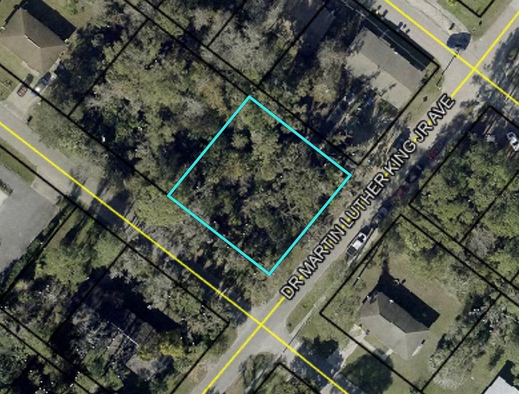 This is an aerial map view of a vacant, wooded residential lot — XXXX S MOORE STREET, BUNNELL, FL