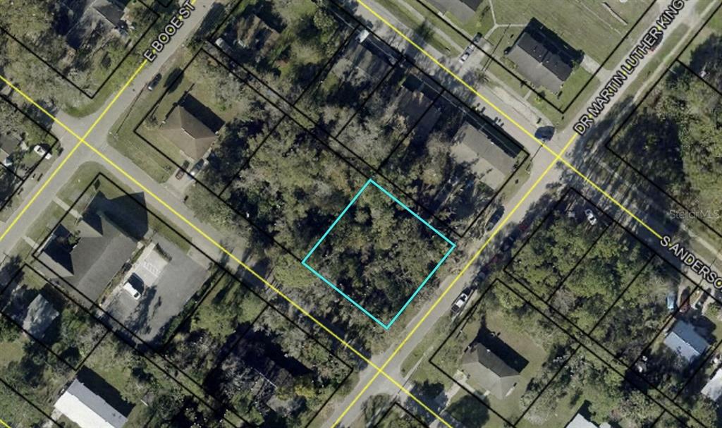 This is an aerial map view of a vacant, tree-covered residential lot — XXXX S MOORE STREET, BUNNELL, FL