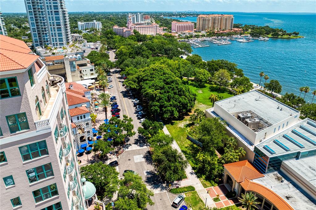 An aerial view shows a coastal city street, a park, and a large waterfront hotel — 288 BEACH DRIVE NE UNIT PH-2A, ST PETERSBURG, FL