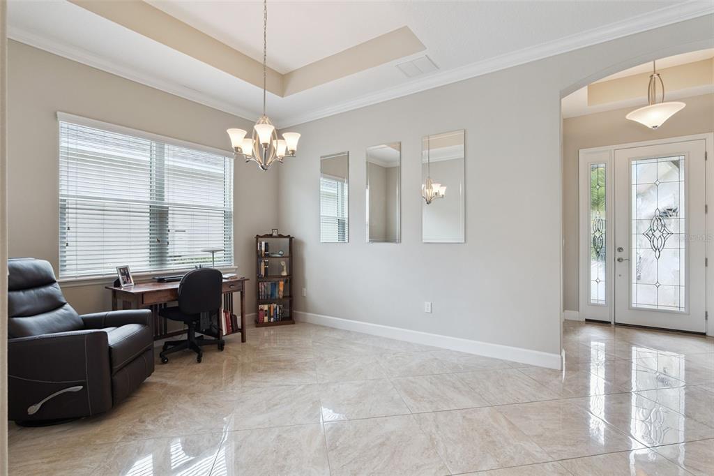 A home office features tile flooring, a tray ceiling, three wall mirrors, and a desk — 1365 BRAYFORD POINT, DELAND, FL