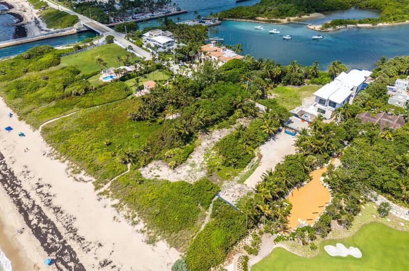 An aerial view shows a coastal property with a beach, vegetation, and nearby houses — 3060 S Ocean Boulevard, Lantana FL 33462, LANTANA, FL