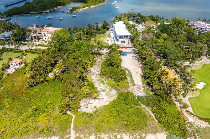 An aerial view shows a coastal property with a large house, dense vegetation, and beach — 3060 S Ocean Boulevard, Lantana FL 33462, LANTANA, FL