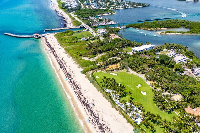 An aerial view shows a beach, a golf course, and a bridge over a waterway — 3060 S Ocean Boulevard, Lantana FL 33462, LANTANA, FL
