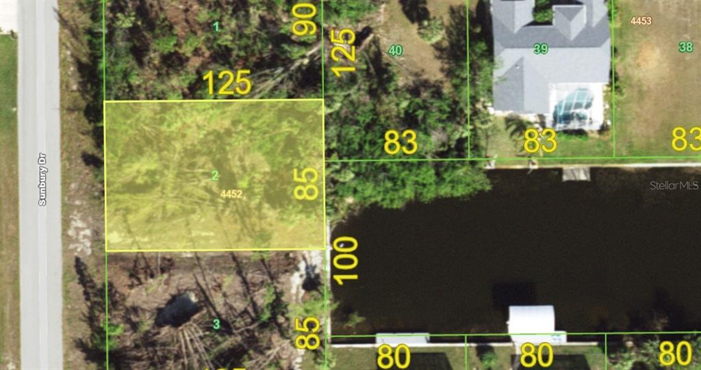 This is an aerial map showing a rectangular residential lot highlighted in yellow — 10394 SUNBURY DRIVE, PORT CHARLOTTE, FL