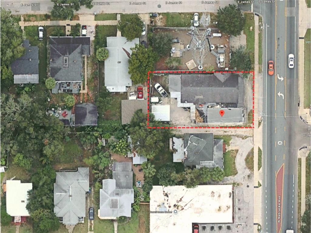 An aerial view shows a rectangular property lot with a building and a communication tower — 3510 N NEBRASKA AVENUE, TAMPA, FL