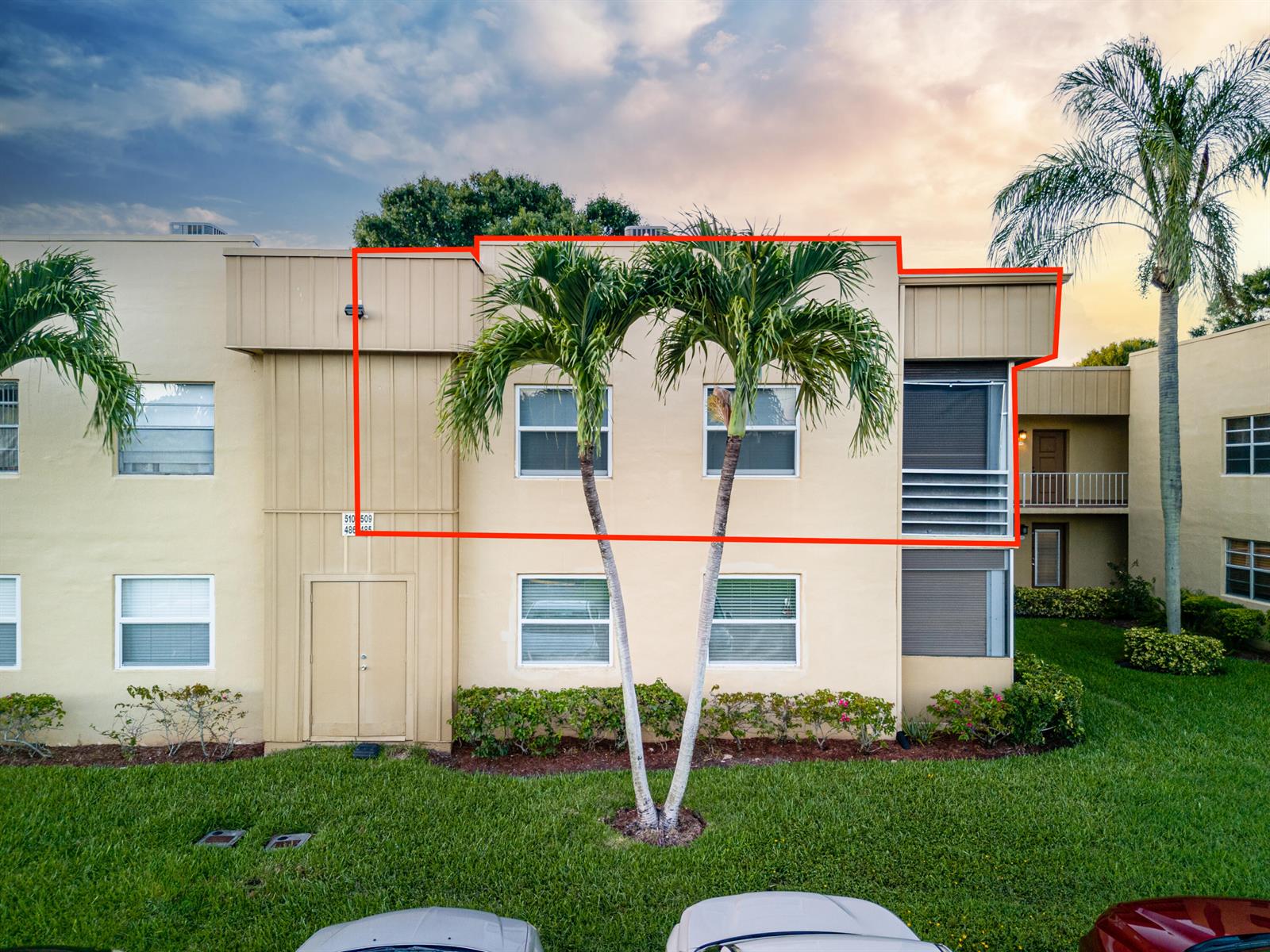 An exterior view of a two-story apartment building with a highlighted upper-level unit — 509 Capri # 509, Delray Beach FL 33484, DELRAY BEACH, FL
