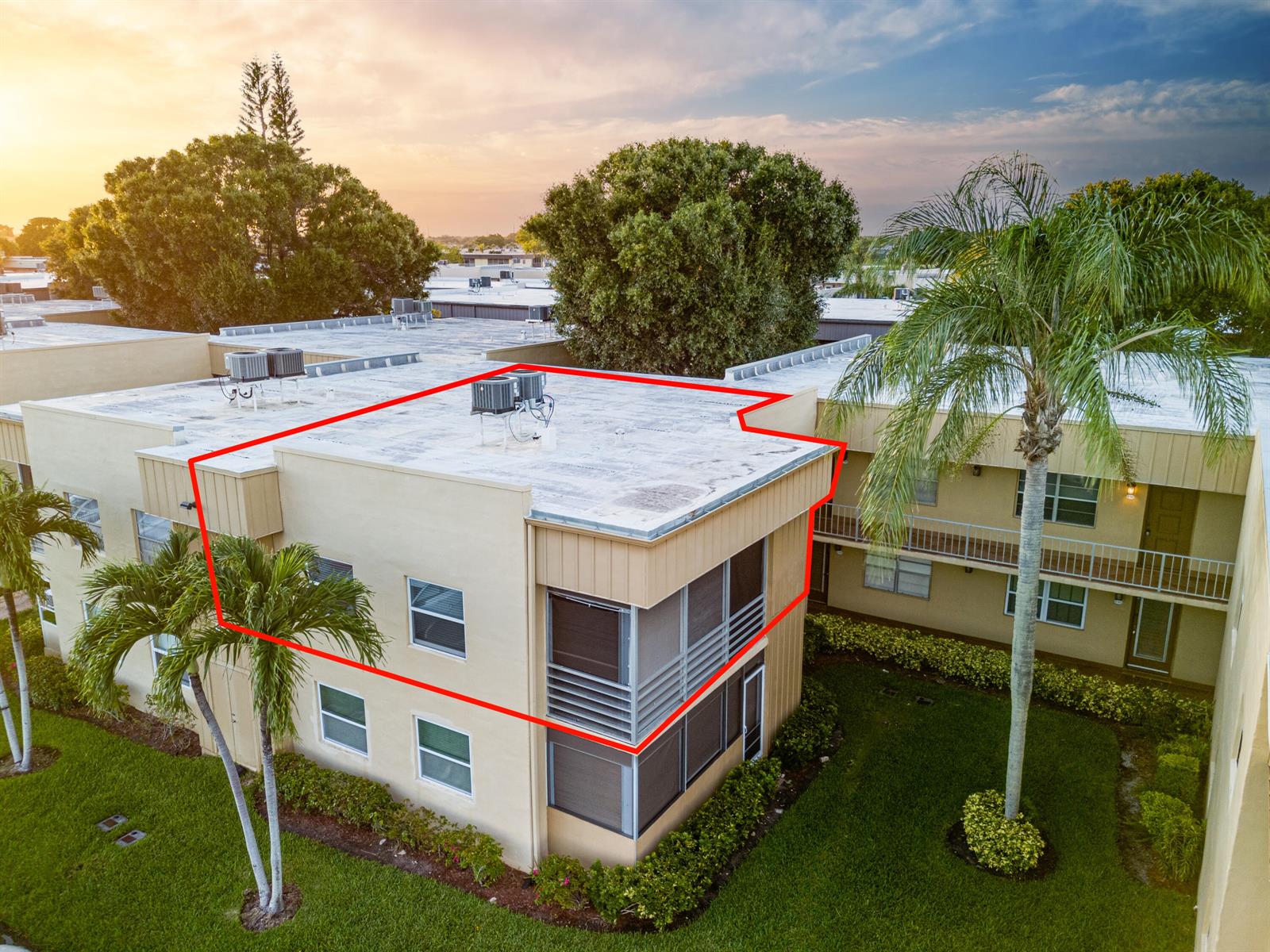 An aerial view of a two-story apartment building with a flat roof and screened balconies — 509 Capri # 509, Delray Beach FL 33484, DELRAY BEACH, FL