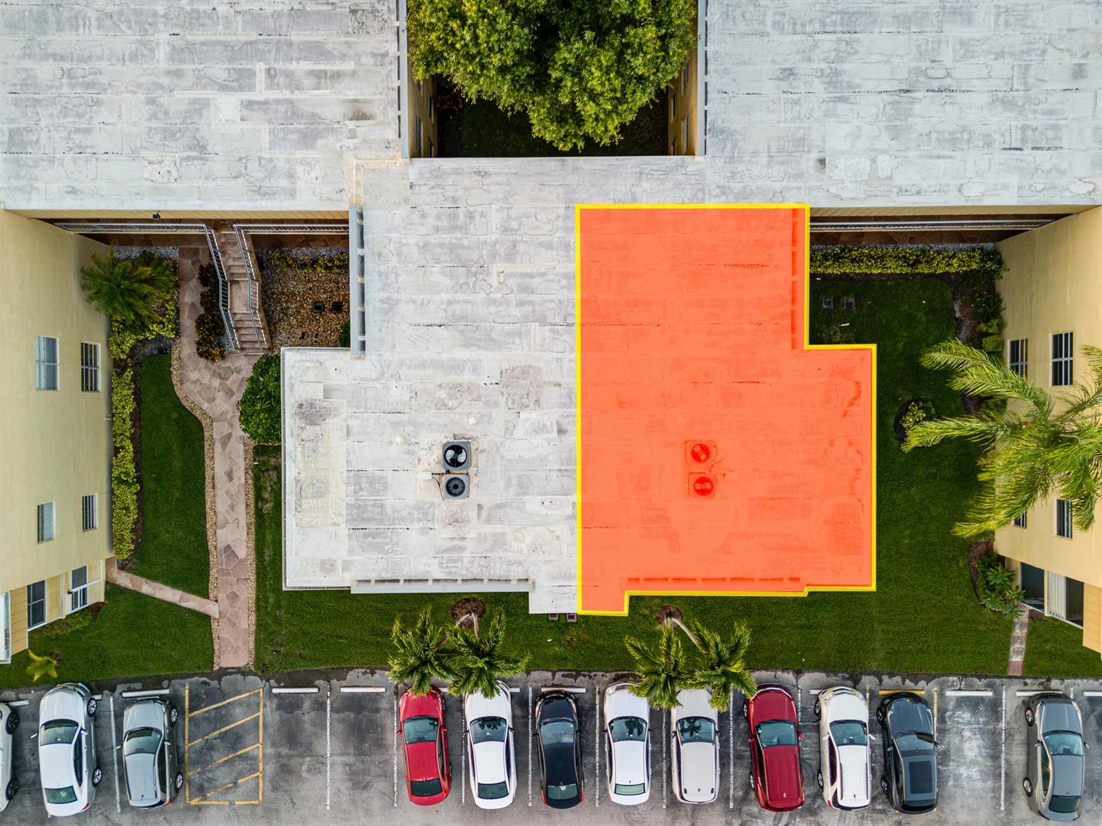 An aerial view shows a flat roof with a highlighted orange section above a parking lot — 509 Capri # 509, Delray Beach FL 33484, DELRAY BEACH, FL