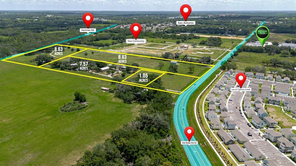 An aerial map shows several parcels of land outlined in yellow near a residential development — 31668 HARTMAN ROAD, SAN ANTONIO, FL