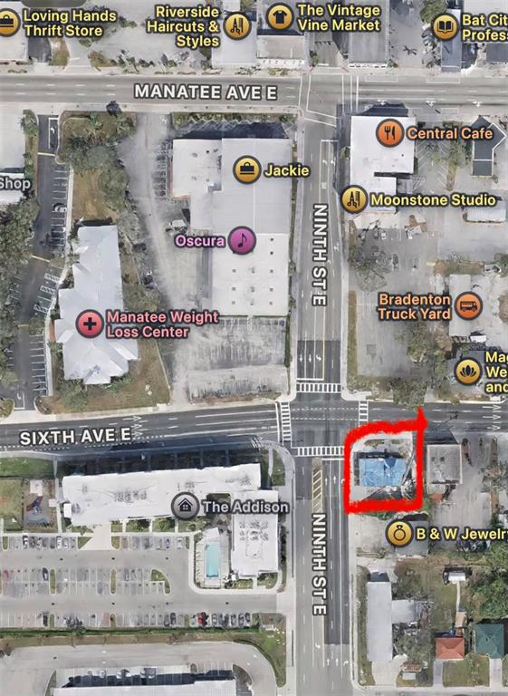 This is an aerial map showing a building highlighted in red at a street intersection — 904 7TH AVENUE E, BRADENTON, FL
