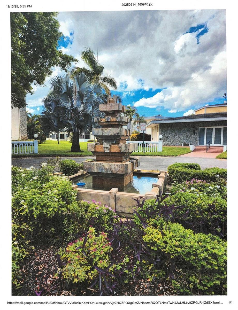 A tiered stone fountain sits in a landscaped garden in front of a residential building — 4411 NW 16, Lauderhill FL 33313, LAUDERHILL, FL