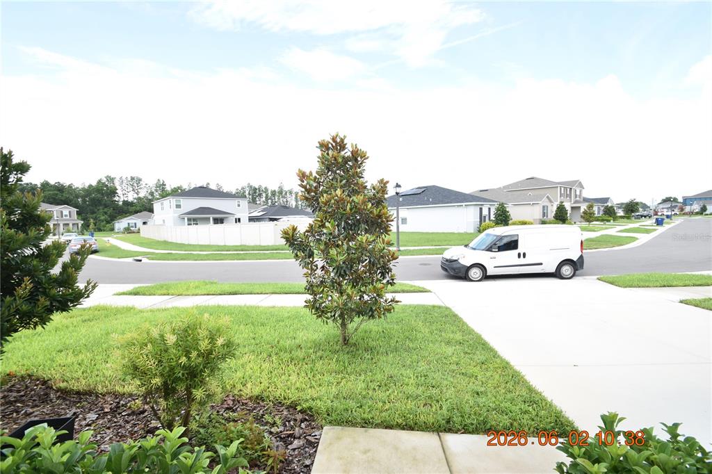 A white van is parked on a suburban street in front of residential houses — 20076 AZUL MARBLE LOOP, LAND O LAKES, FL