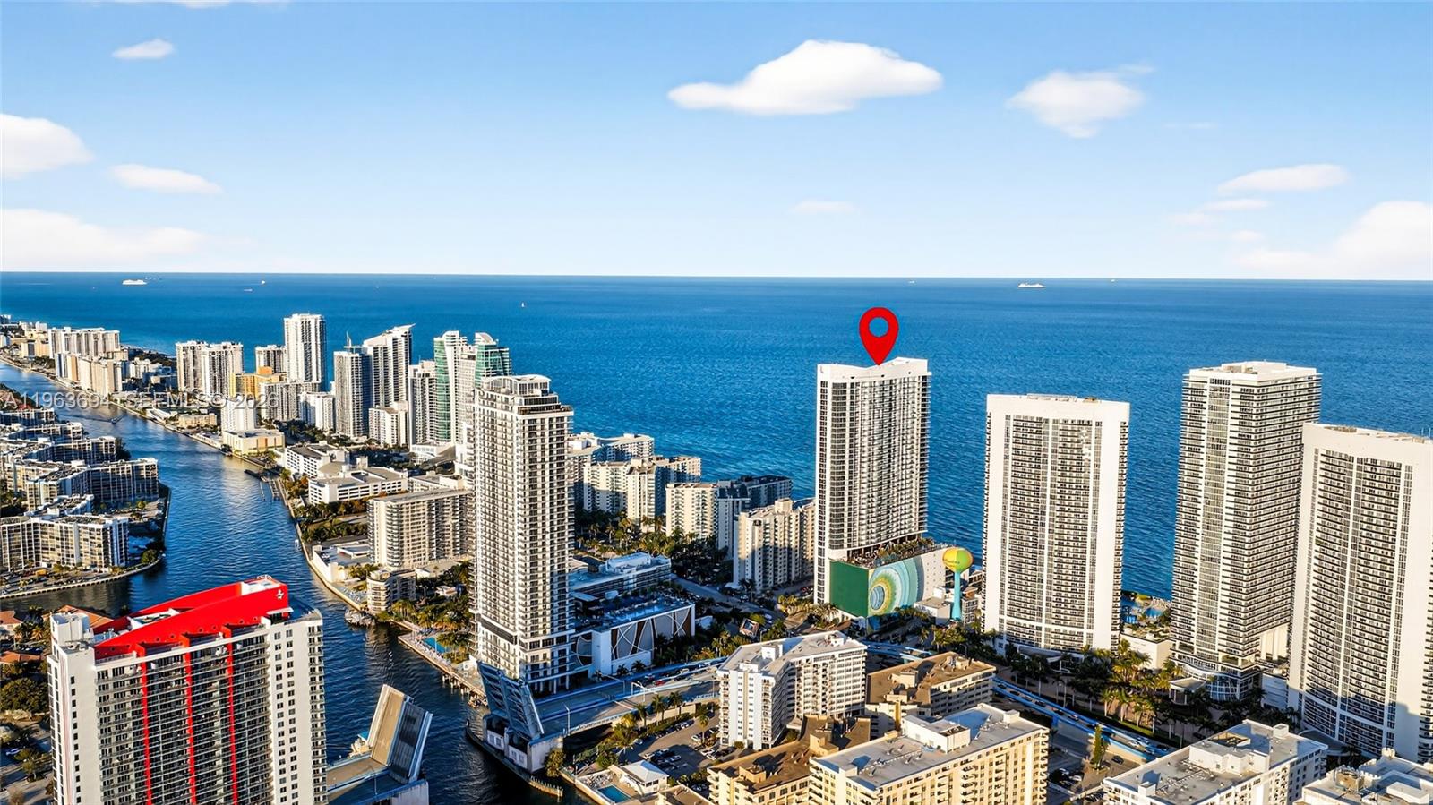 An aerial view shows a coastal city skyline with a red pin marking a high-rise building — 4111 S Ocean Dr # 3703, Hollywood FL 33019, HOLLYWOOD, FL