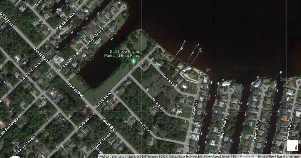 This is a satellite map view of a residential neighborhood featuring a private park and boat ramp — 3119 GILLOT BOULEVARD, PORT CHARLOTTE, FL