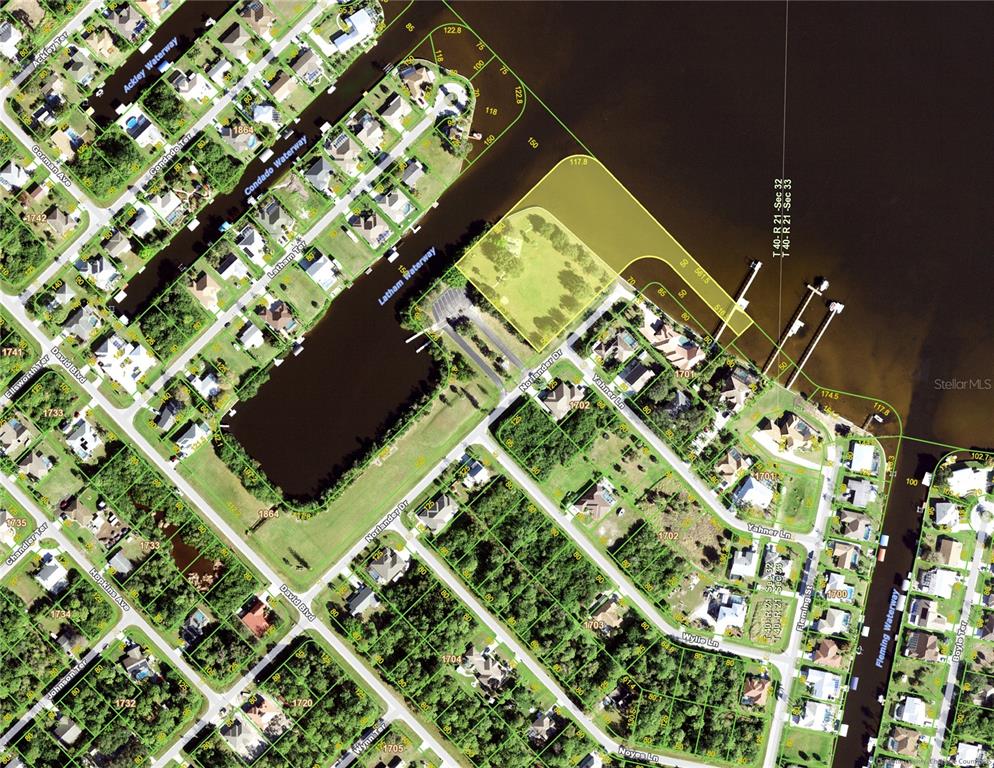 This is an aerial map showing residential lots, waterways, and streets in a suburban neighborhood — 3119 GILLOT BOULEVARD, PORT CHARLOTTE, FL