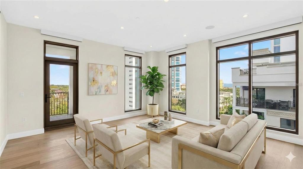 A modern living room features light-colored furniture, a marble coffee table, and large floor-to-ceiling windows — 126 4TH AVENUE NE UNIT 601, ST PETERSBURG, FL