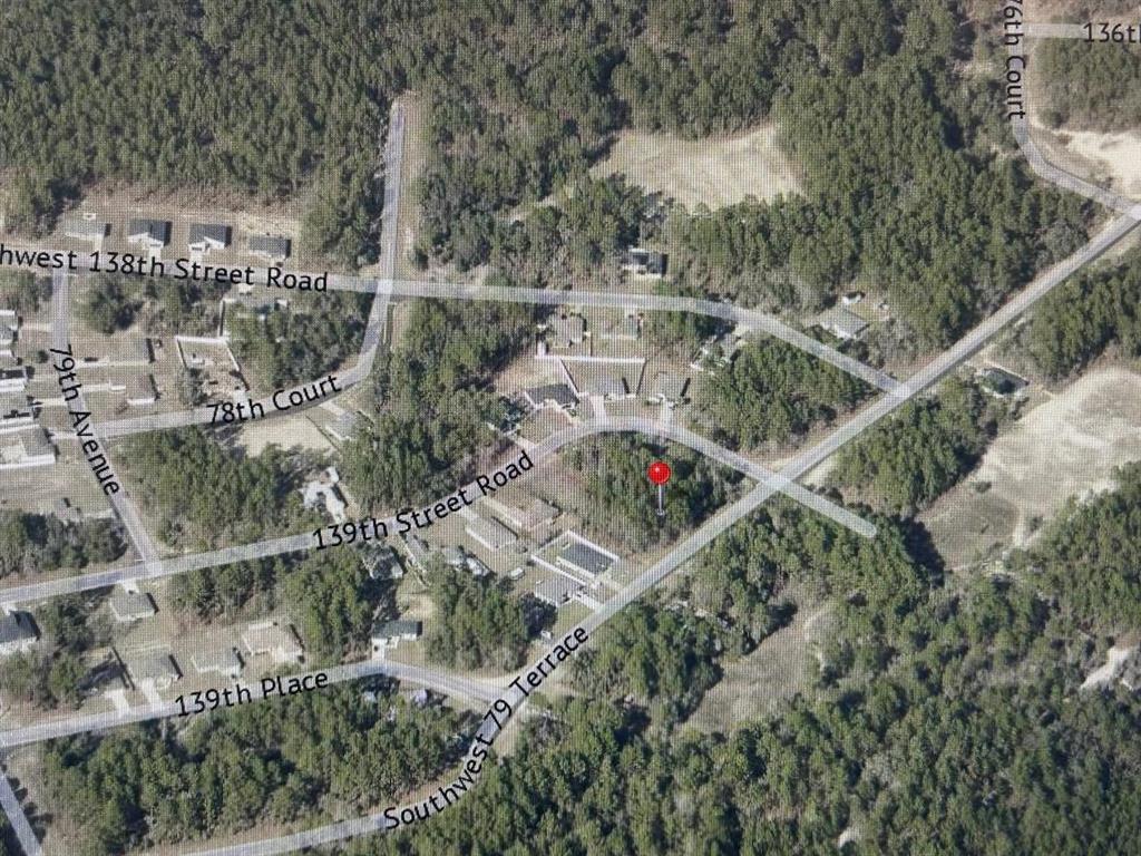 This is an aerial map showing a vacant lot marked with a red pin — 0 SW 79TH TERRACE RD, OCALA, FL