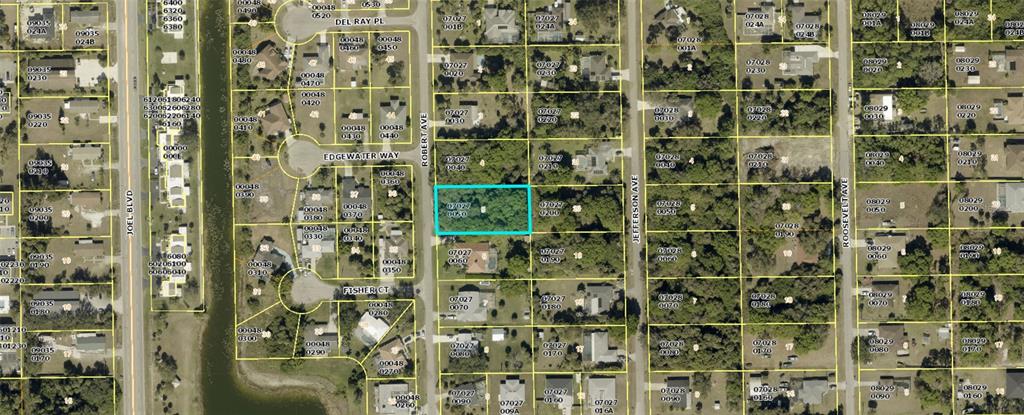 This is an aerial map showing a highlighted vacant lot located between Robert Avenue and Jefferson Avenue — 614 ROBERT AVENUE, LEHIGH ACRES, FL